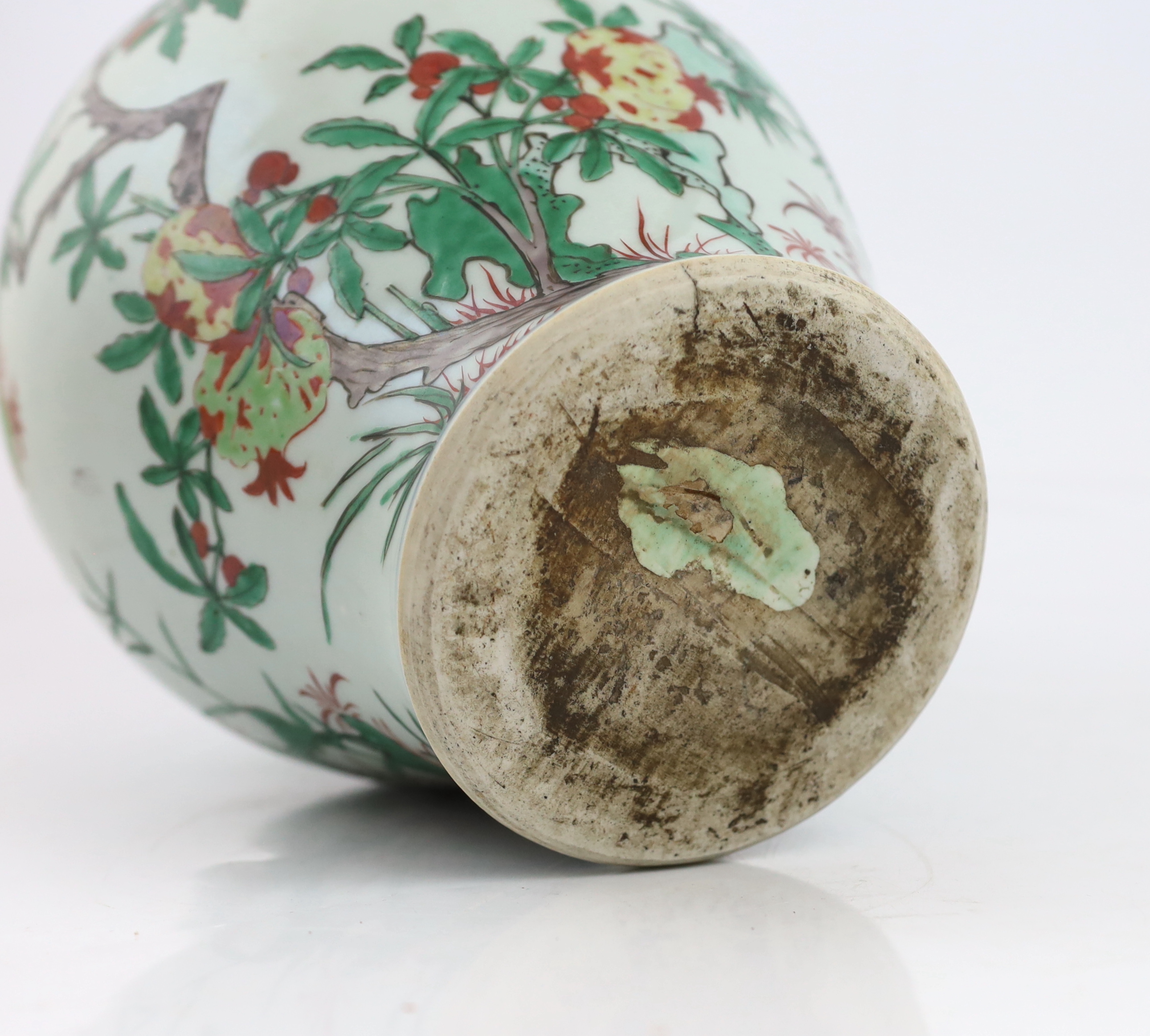 A Chinese wucai ‘pomegranate’ baluster vase, Transitional, Shunzhi period, c.1650